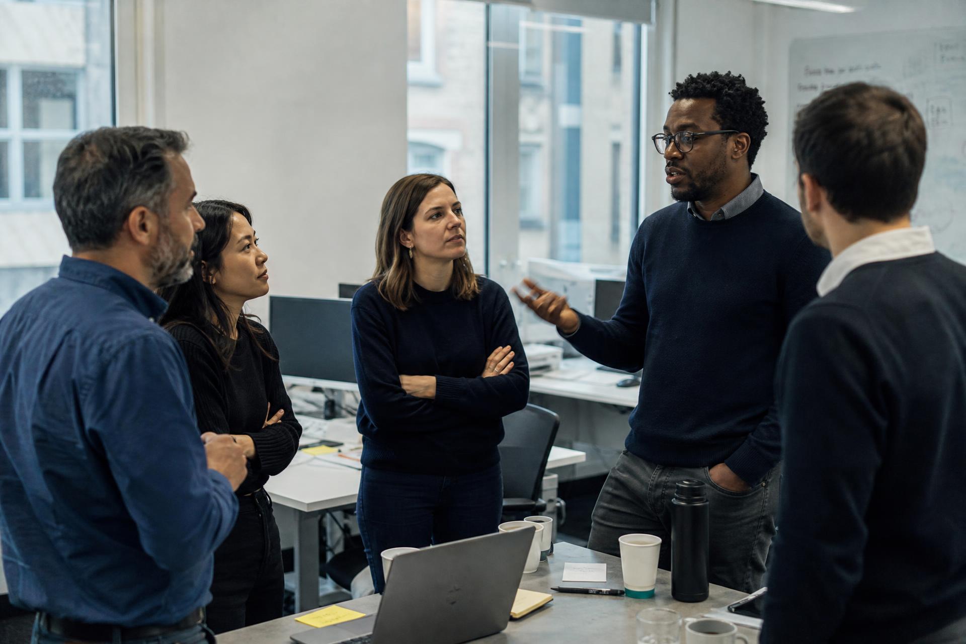 Commercial leaders reviewing sales performance reporting during a working session